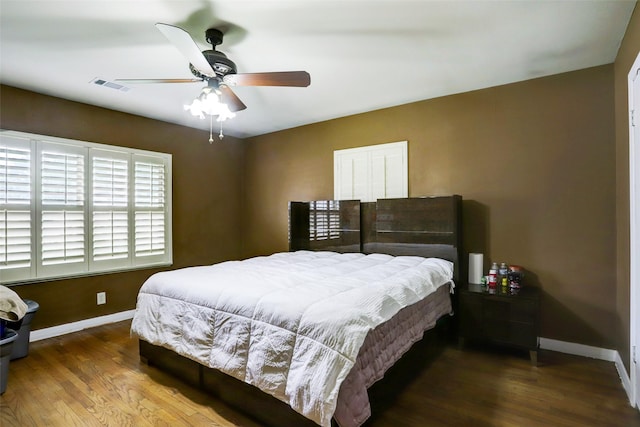 bedroom featuring hardwood / wood-style flooring and ceiling fan