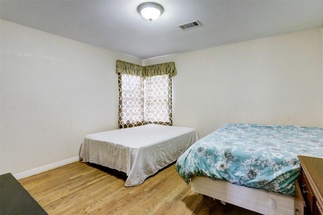 bedroom featuring hardwood / wood-style flooring