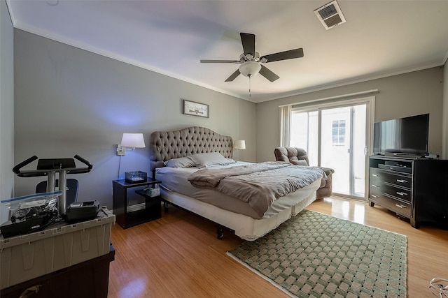 bedroom with access to exterior, ceiling fan, light hardwood / wood-style flooring, and crown molding