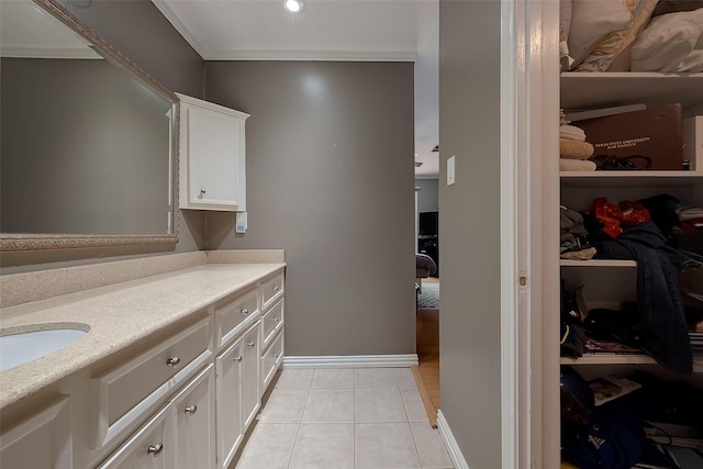 interior space featuring sink, white cabinetry, and light tile patterned floors