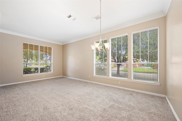 carpeted empty room featuring a notable chandelier, crown molding, and plenty of natural light