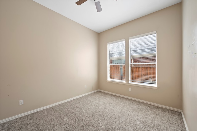 empty room with carpet and ceiling fan