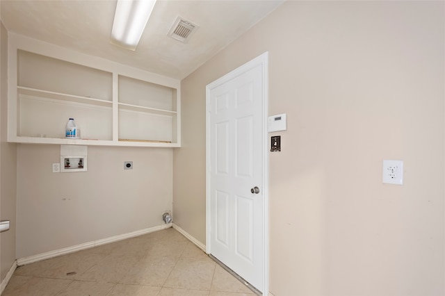 clothes washing area featuring washer hookup, electric dryer hookup, and light tile patterned floors