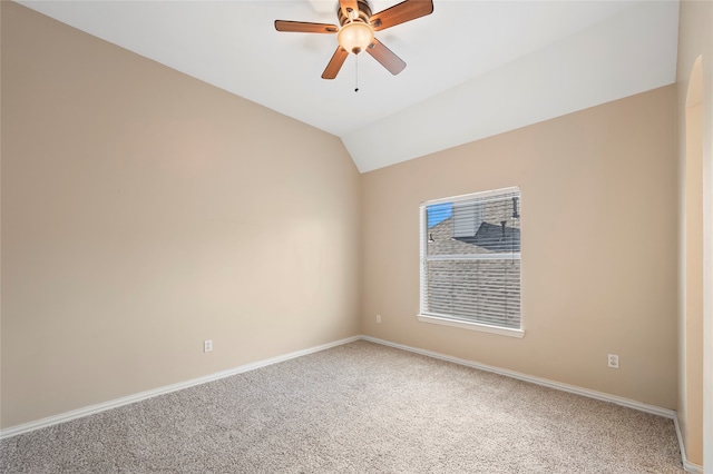 spare room with lofted ceiling, carpet flooring, and ceiling fan