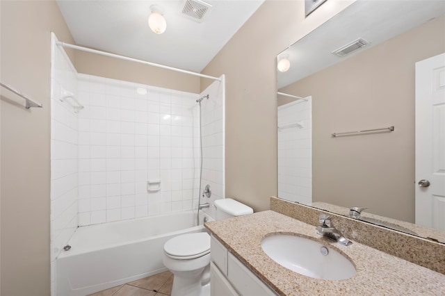 full bathroom featuring vanity, tiled shower / bath combo, toilet, and tile patterned flooring