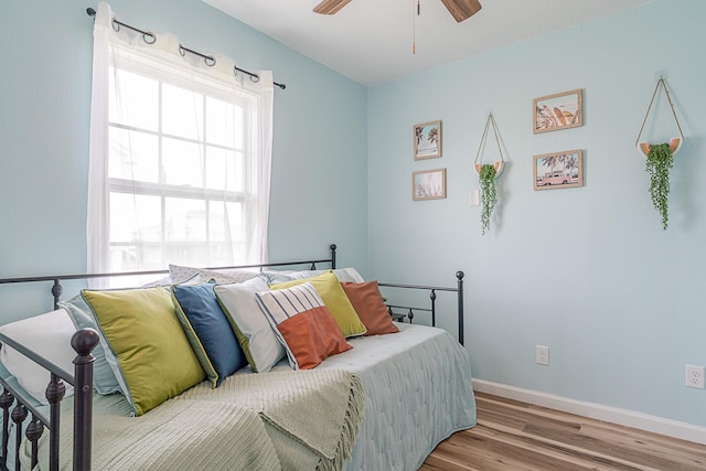 bedroom with ceiling fan and light hardwood / wood-style flooring