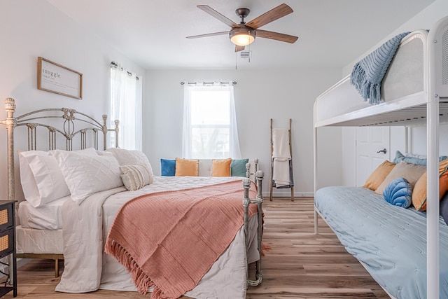 bedroom featuring ceiling fan and wood-type flooring