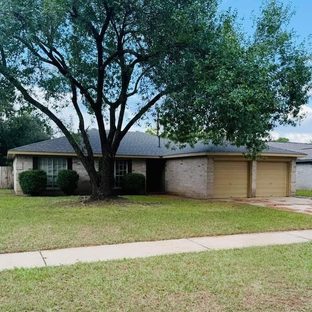 single story home with a garage and a front yard