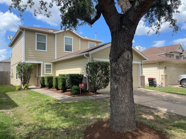 view of front of house with a garage and a front lawn