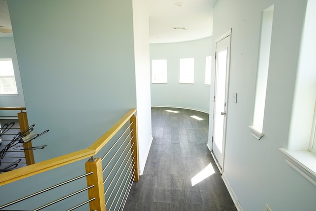 corridor with dark hardwood / wood-style floors