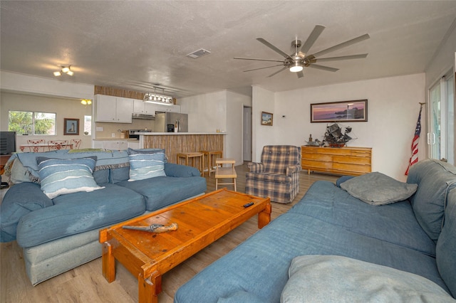 11 Lauderdale, Rockport, TX 78382 - living area featuring light wood-type flooring and a ceiling fan