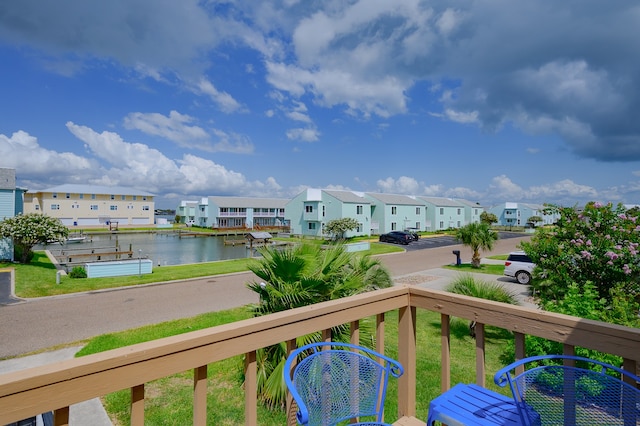 balcony featuring a water view