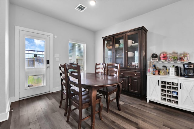 dining room with dark hardwood / wood-style flooring