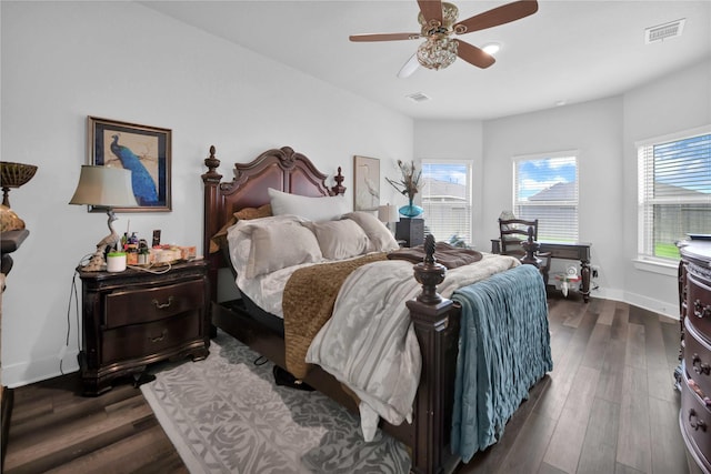 bedroom featuring ceiling fan and dark hardwood / wood-style floors