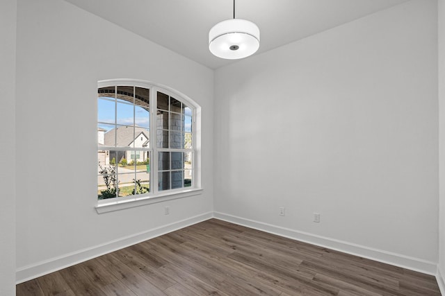 spare room featuring dark hardwood / wood-style floors