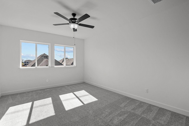 spare room featuring carpet flooring and ceiling fan