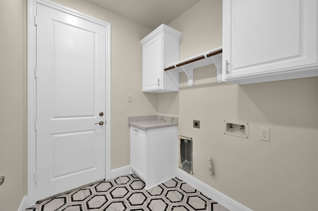 laundry area with hookup for a washing machine, hookup for a gas dryer, cabinets, hookup for an electric dryer, and light tile patterned flooring