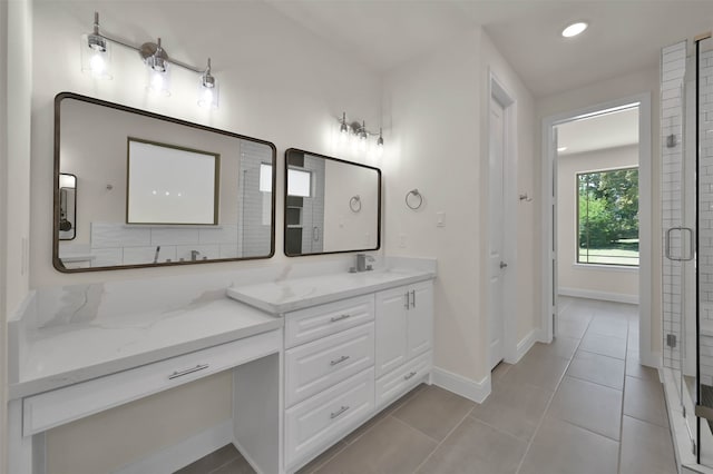 bathroom featuring tile patterned flooring and vanity