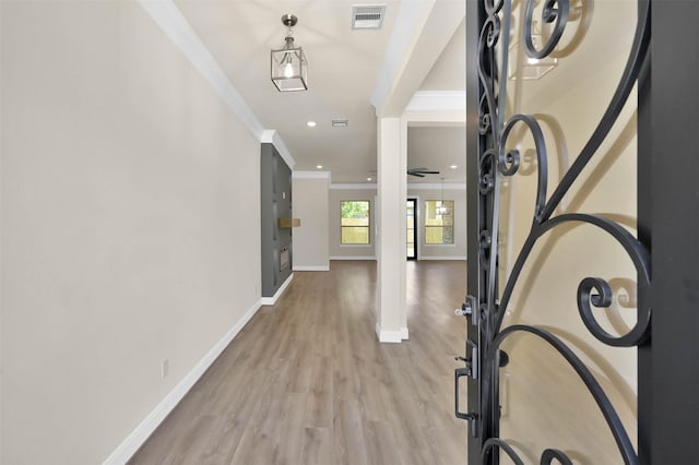 foyer entrance with recessed lighting, wood finished floors, visible vents, baseboards, and ornamental molding