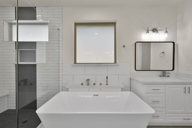 bathroom featuring tile walls, independent shower and bath, and vanity