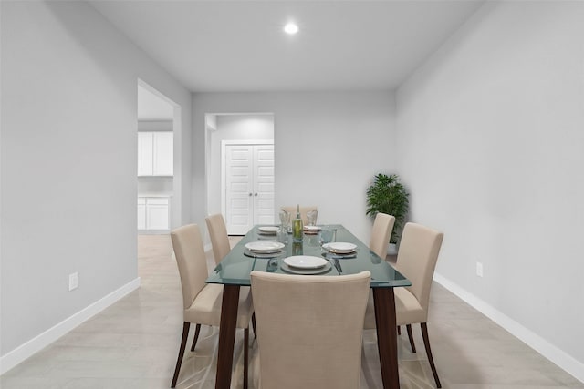 dining space featuring light wood-type flooring