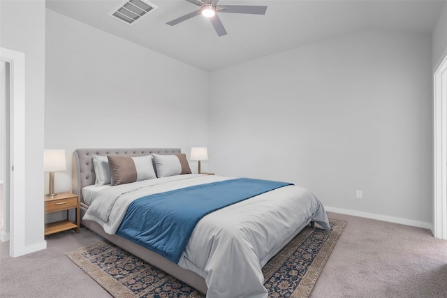 carpeted bedroom featuring ceiling fan and vaulted ceiling