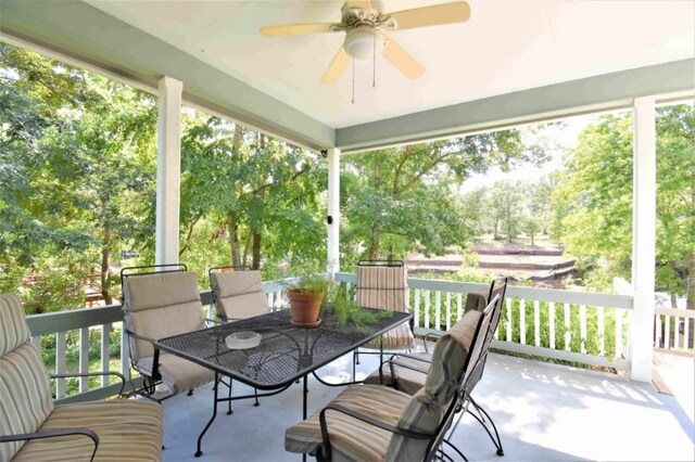 exterior space with ceiling fan