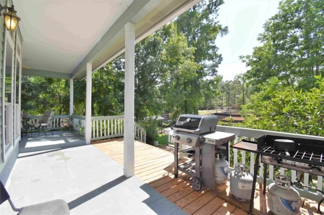 wooden deck featuring area for grilling