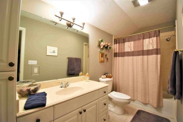 full bathroom featuring tile patterned floors, a textured ceiling, vanity, toilet, and lofted ceiling