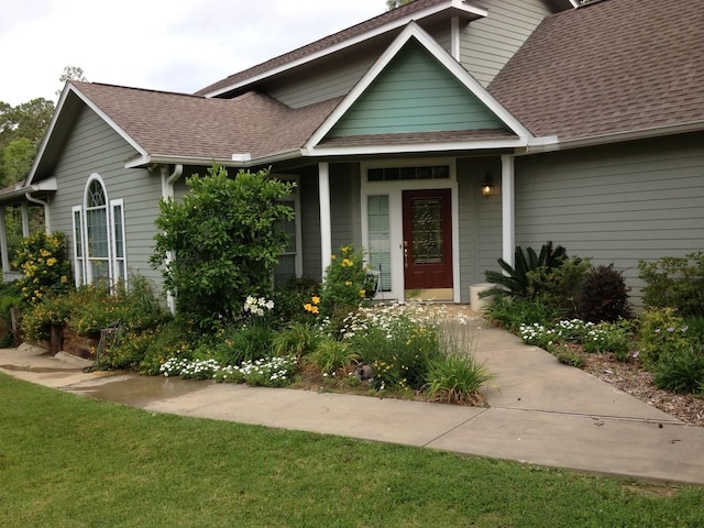 view of front of home featuring a shingled roof