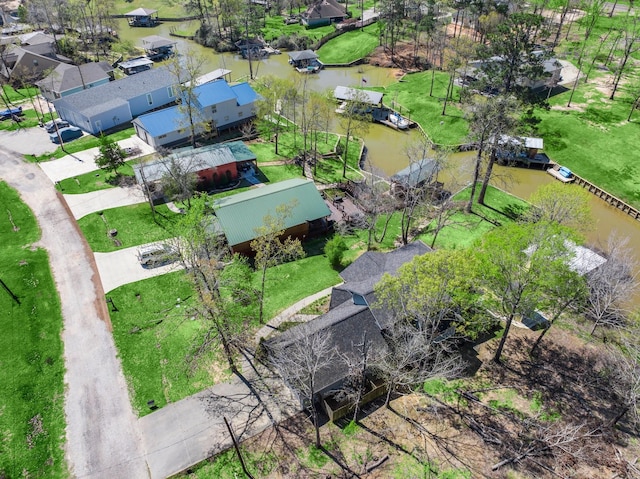 drone / aerial view featuring a water view and a residential view