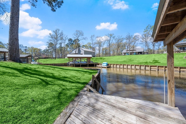 view of dock featuring a water view, a gazebo, and a yard