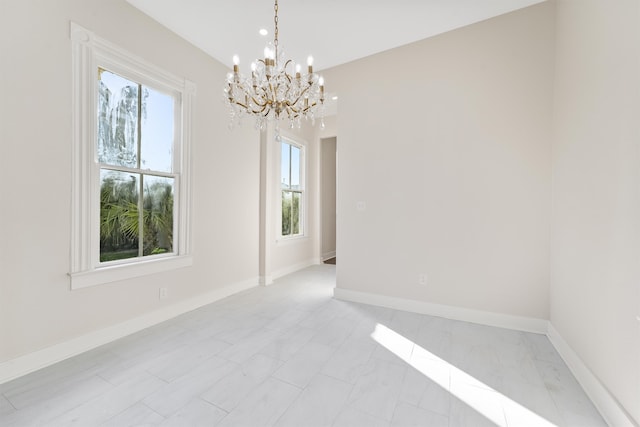 empty room with an inviting chandelier