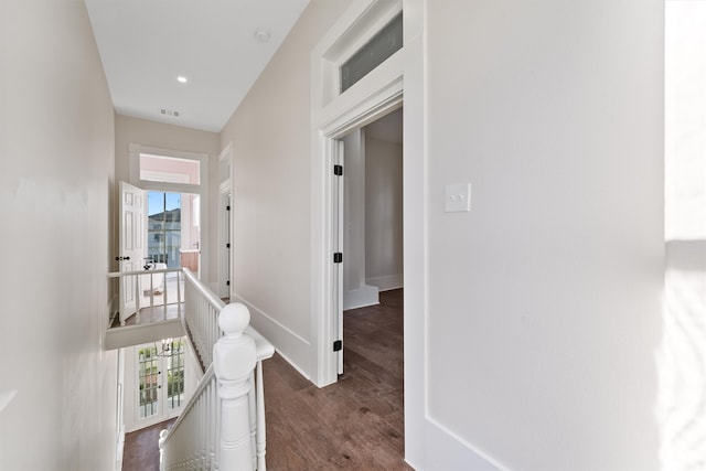 hallway with dark hardwood / wood-style flooring