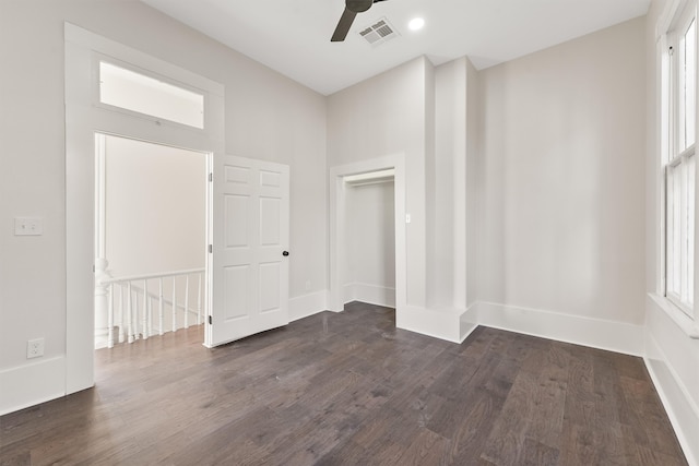 unfurnished room with ceiling fan and dark hardwood / wood-style flooring