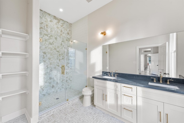 bathroom featuring double vanity, a stall shower, tile patterned flooring, and a sink