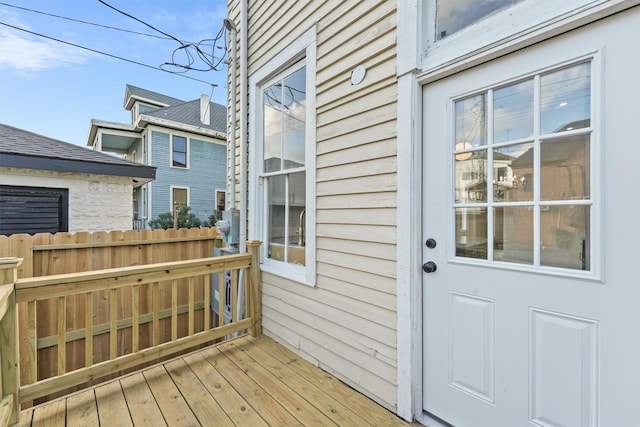 wooden terrace featuring fence