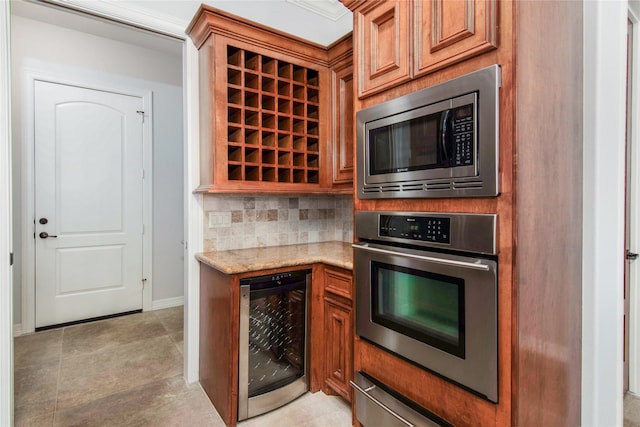 kitchen featuring tasteful backsplash, stainless steel appliances, beverage cooler, and light stone counters