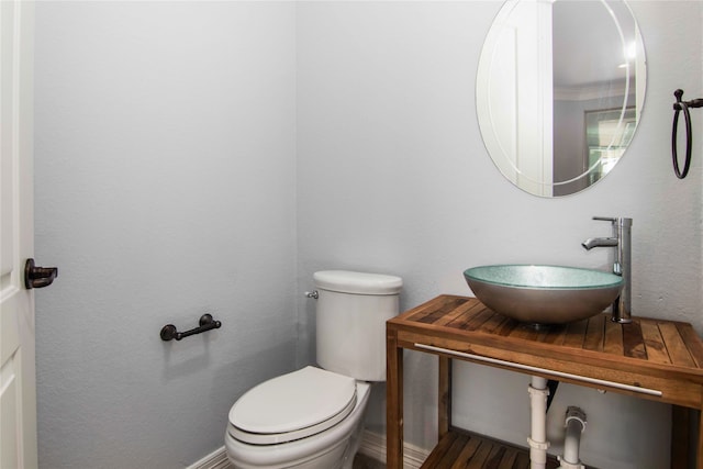 bathroom with toilet and sink