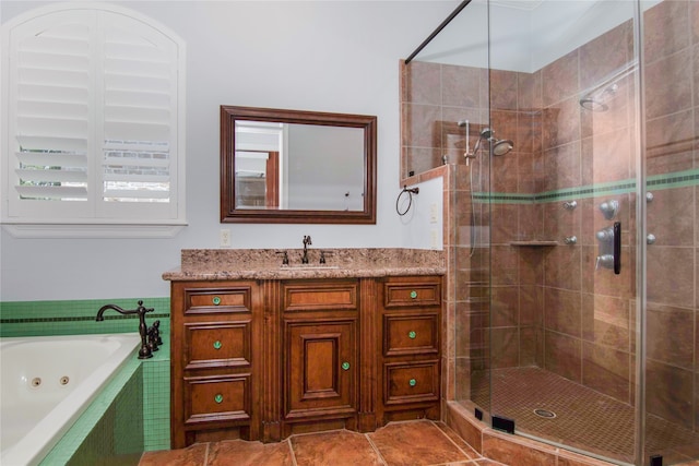 bathroom with vanity, tile patterned floors, and separate shower and tub