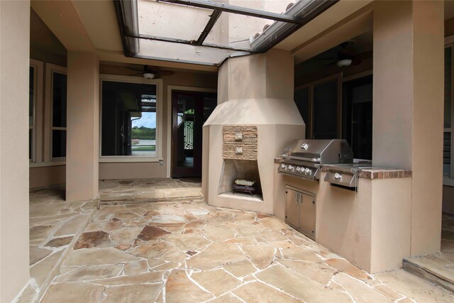 view of patio featuring area for grilling and an outdoor kitchen