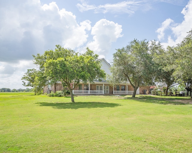 view of yard with covered porch