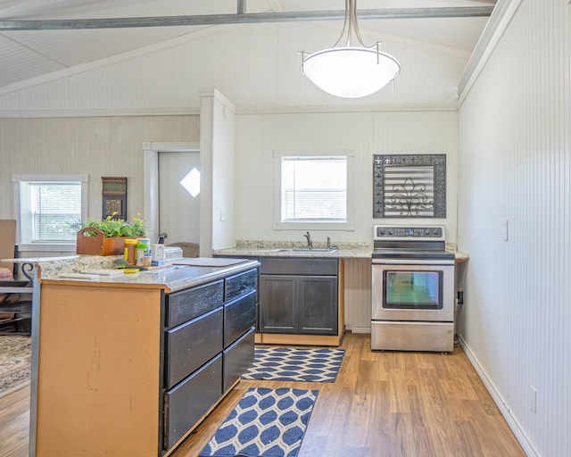 kitchen featuring sink, light hardwood / wood-style flooring, electric stove, and vaulted ceiling