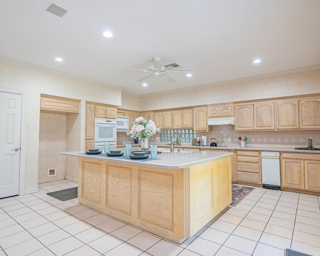 kitchen with light countertops, a ceiling fan, light brown cabinetry, light tile patterned floors, and white microwave