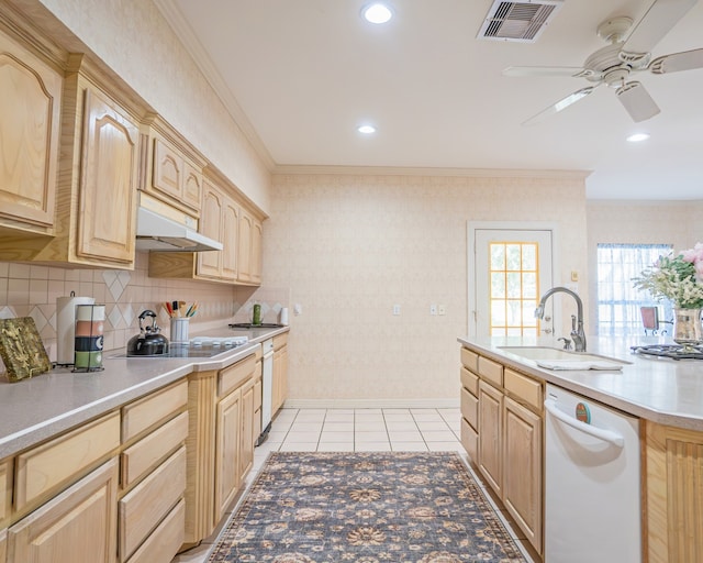 kitchen with tasteful backsplash, white dishwasher, stainless steel gas stovetop, light tile patterned floors, and ceiling fan