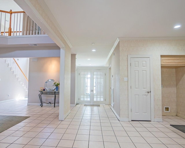 foyer entrance featuring stairway, french doors, light tile patterned floors, ornamental molding, and visible vents