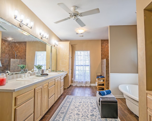 bathroom featuring separate shower and tub, ceiling fan, hardwood / wood-style floors, and double sink vanity