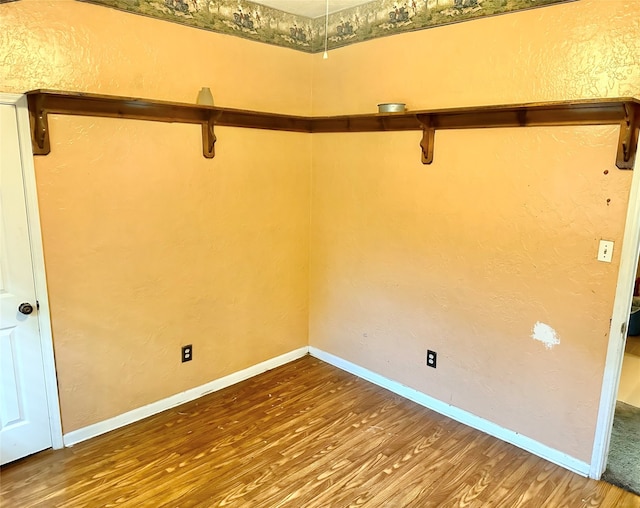 empty room with wood-type flooring