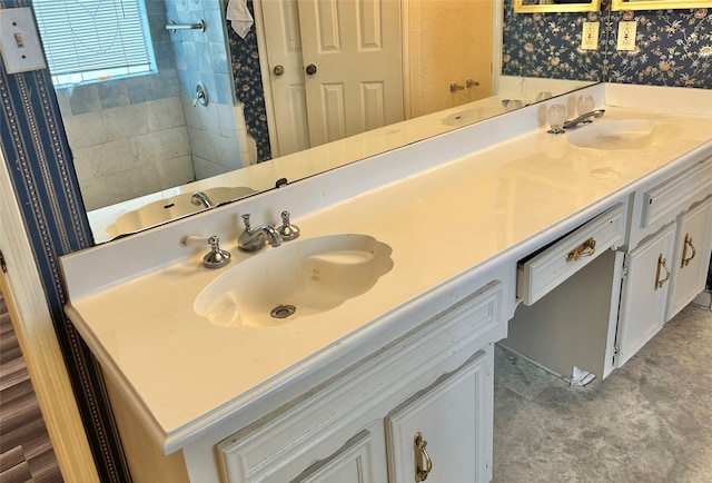 bathroom with tile patterned floors and double sink vanity