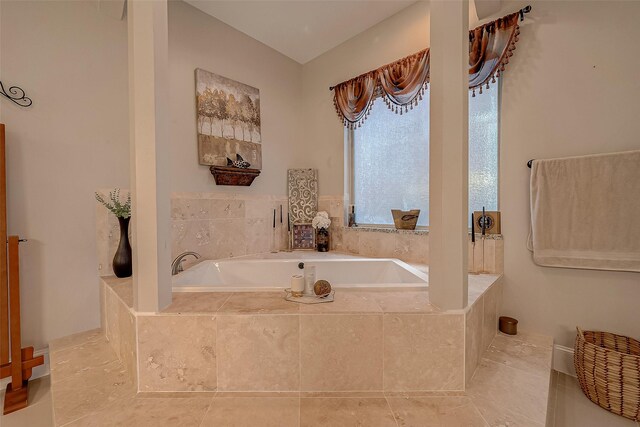 bathroom featuring a relaxing tiled tub